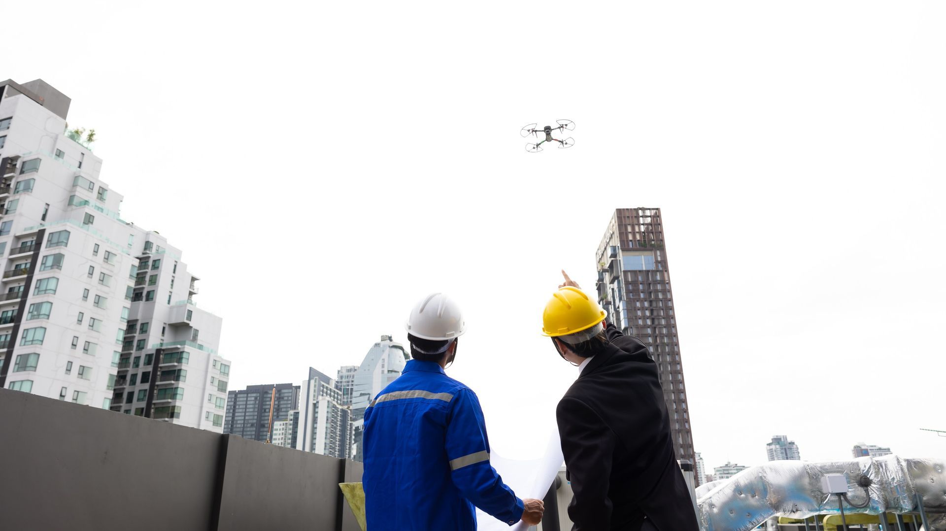 Professional inspection engineering use drone for survey building under construction site