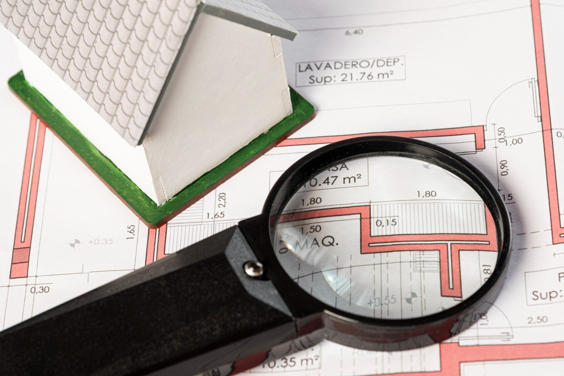 high-view-real-estate-plans-with-magnifying-glass
