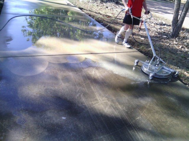 Men Cleaning The Concrete Floor — Carpet Cleaning In Townsville QLD