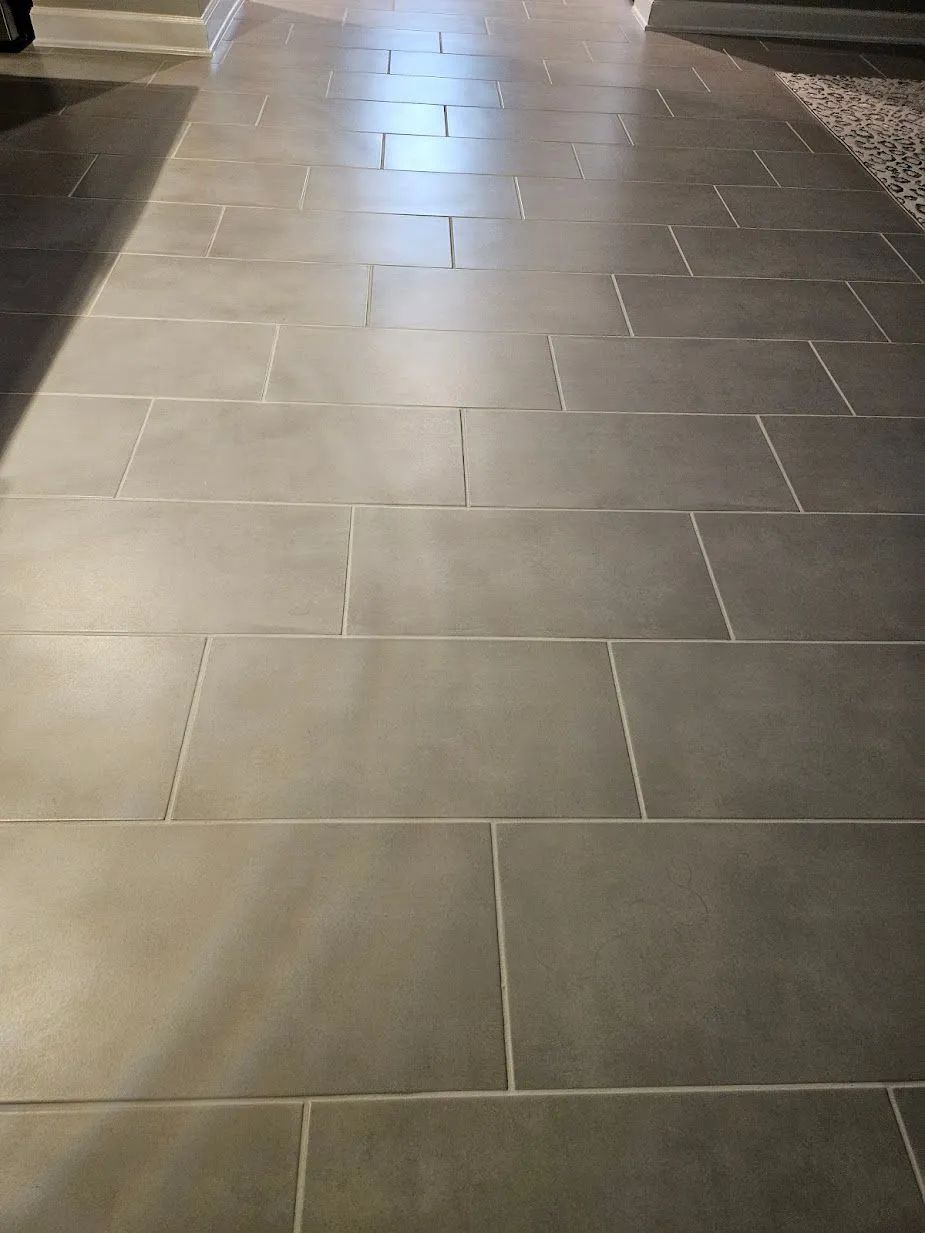 Gray rectangular stone tiles laid in a path, lit from above.