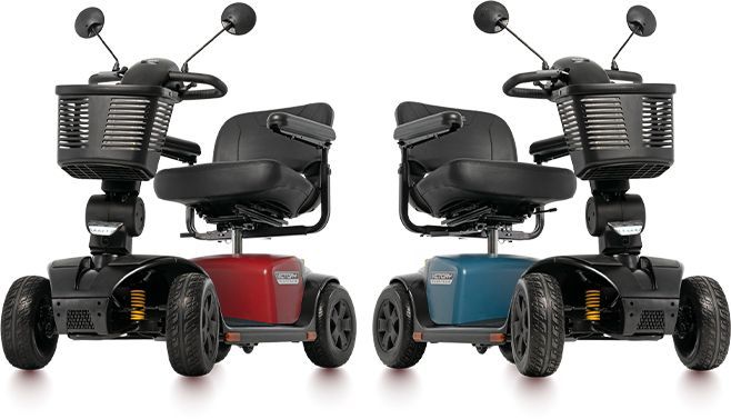 A red and a blue mobility scooter are sitting next to each other on a white background.