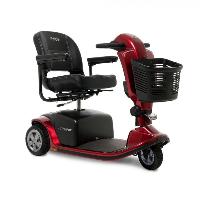 A red mobility scooter with a basket attached to it on a white background.