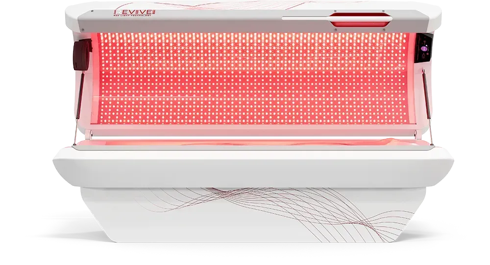 Red light therapy device, white with red lights, used for wellness.