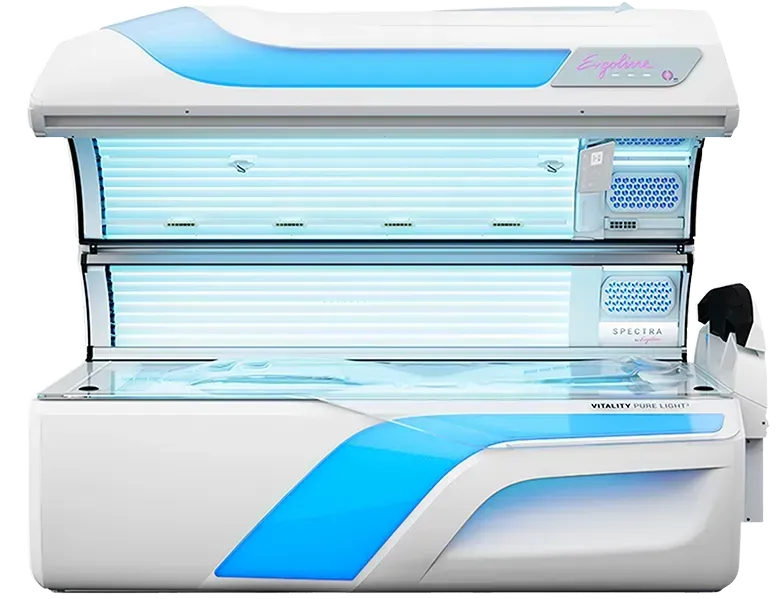 White and blue tanning bed with open panels, radiating blue light.
