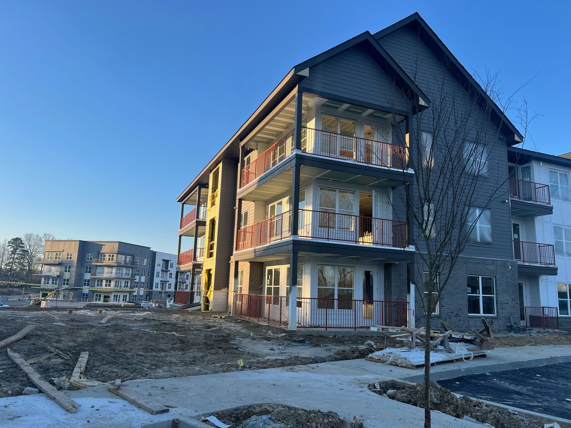 A large apartment building under construction with a lot of windows and balconies.