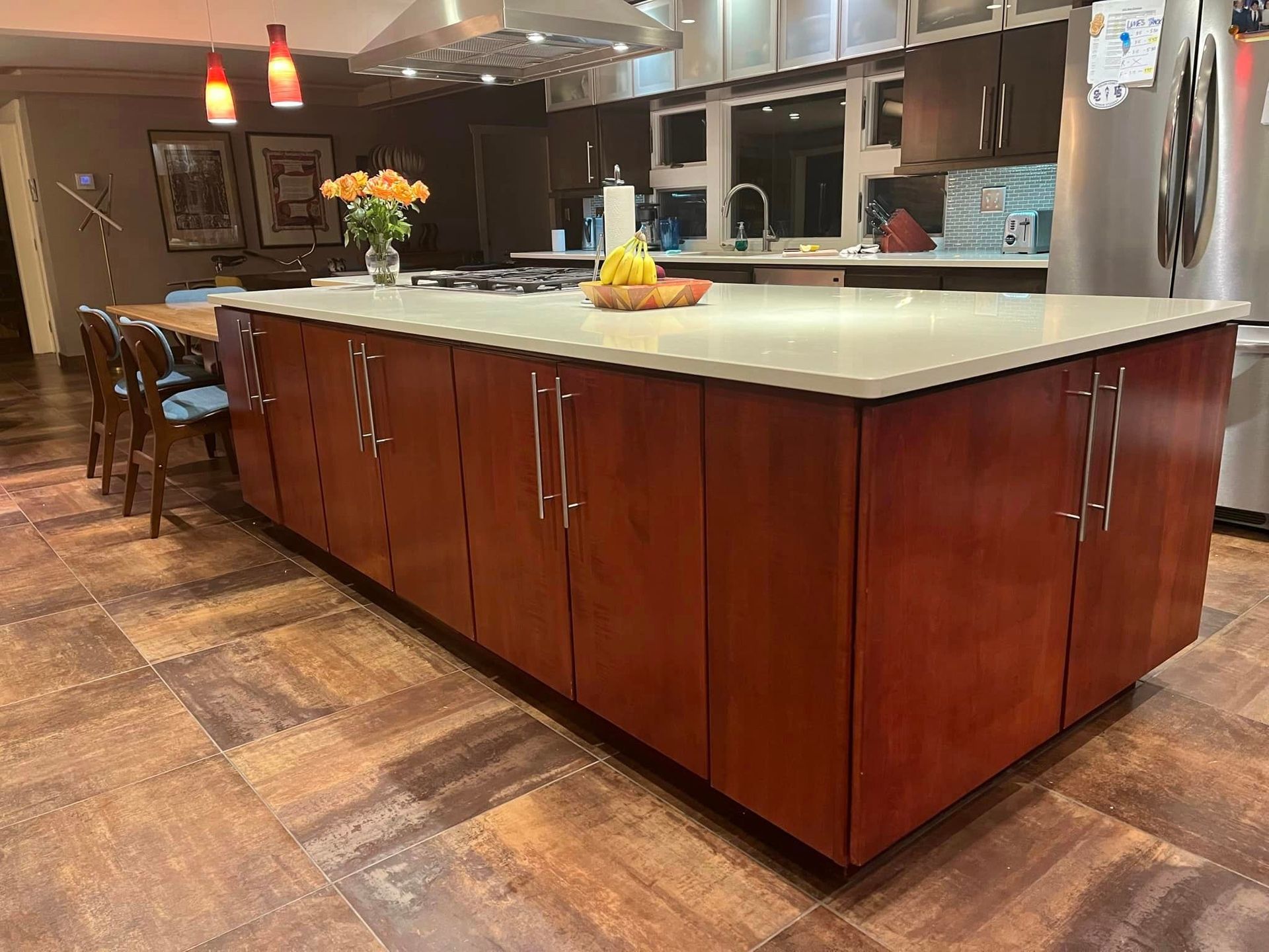 There is a large island in the middle of the kitchen.