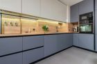 A kitchen with a lot of cabinets and a microwave oven.