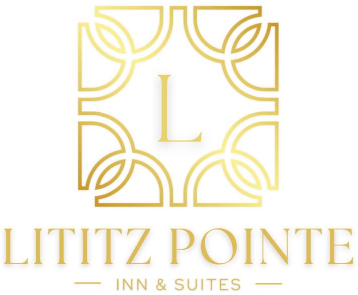 A gold logo for lititz pointe inn and suites