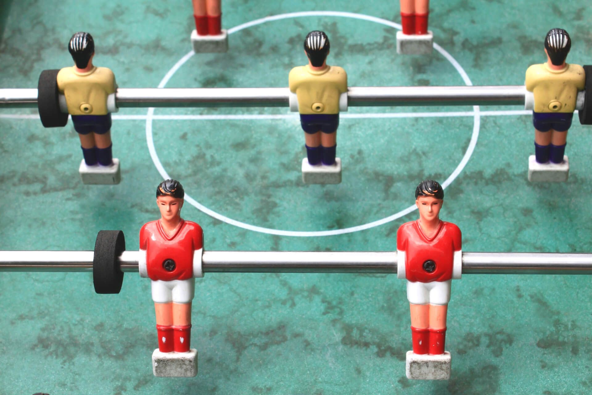 A foosball table with a few players on it