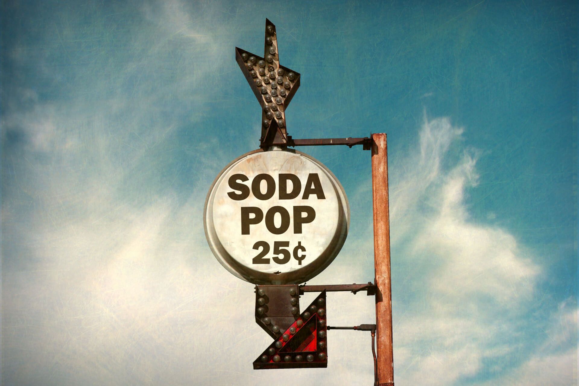 A sign for a soda pop for 25 cents