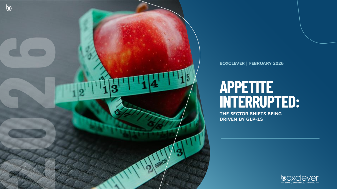 A woman with a backpack is walking down a street.