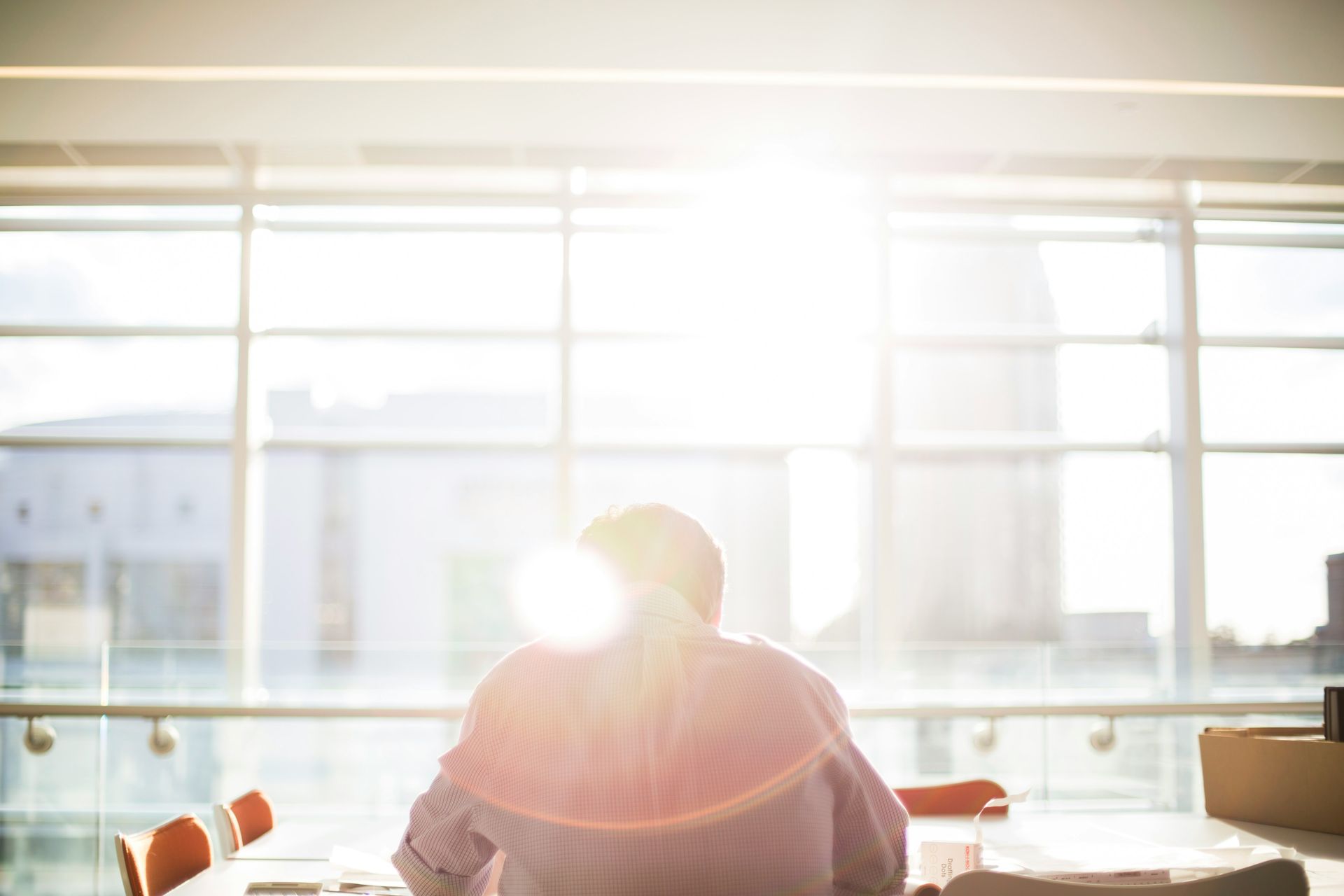 A single analyst sits alone at a desk