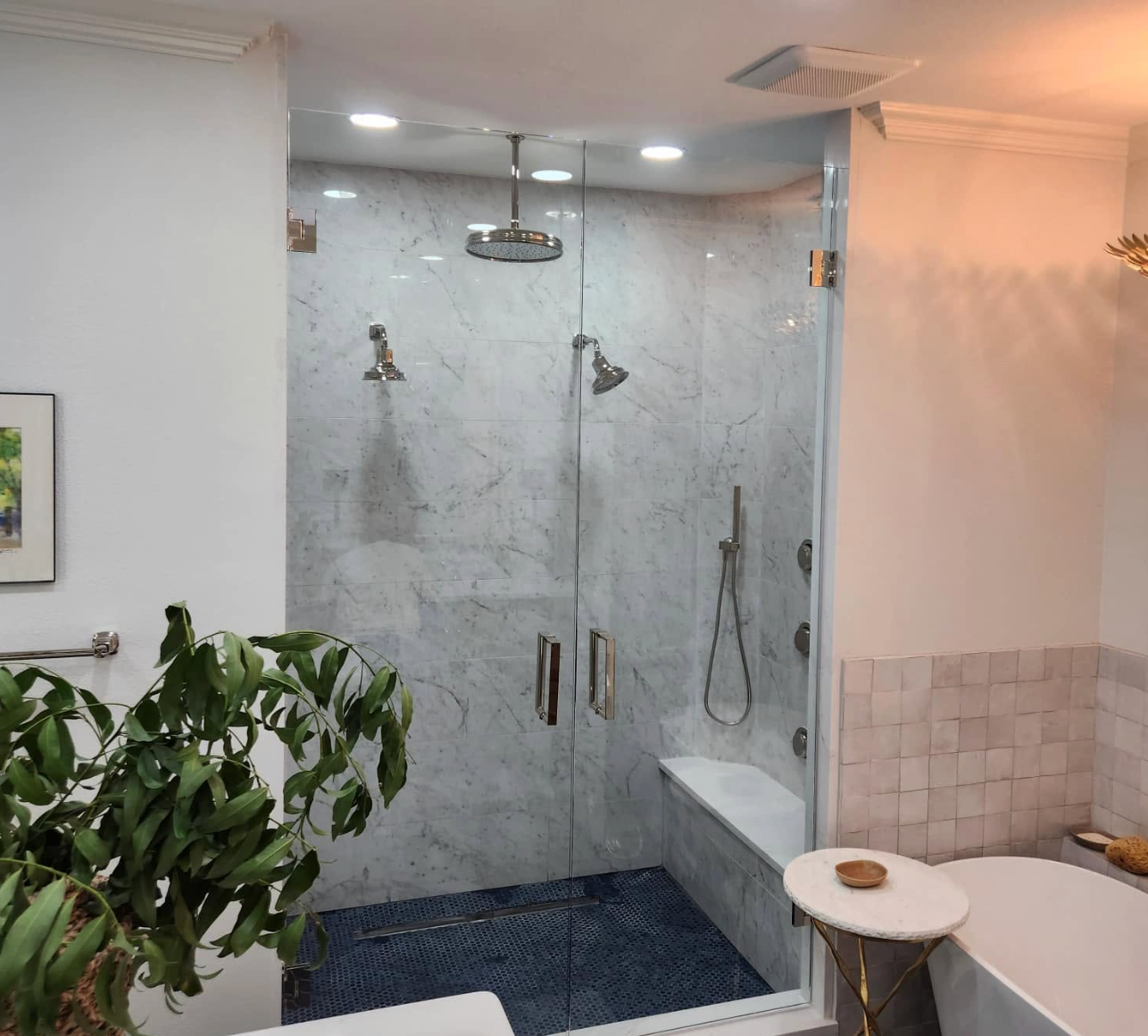 Modern frameless glass shower door in a Fort Worth bathroom remodel