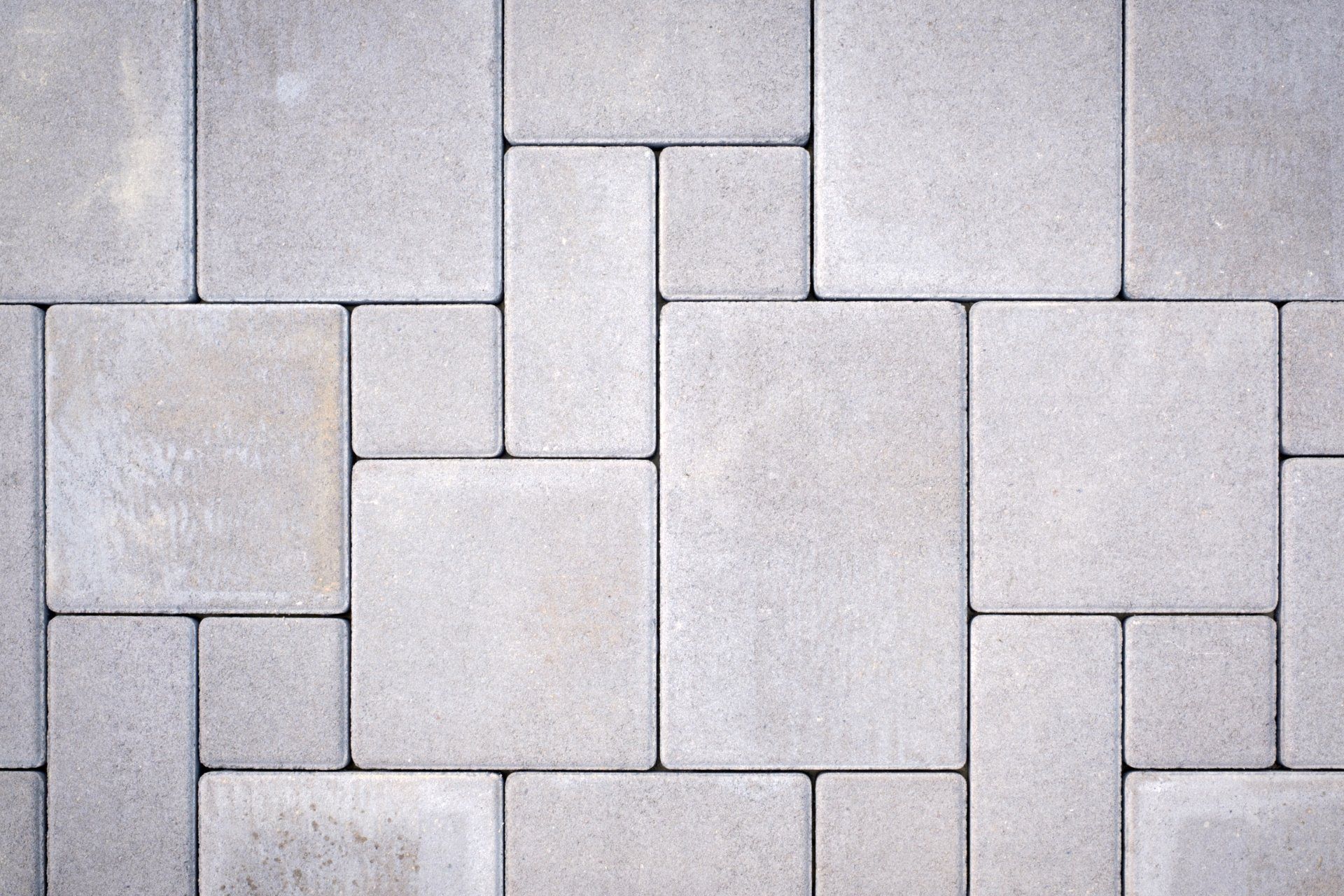 Gray concrete paving stones in a beautiful pattern.