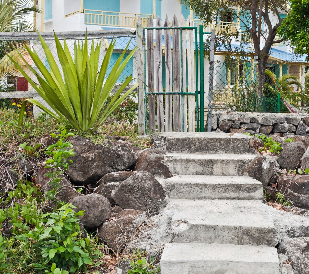 a set of concrete stairs leading up to a house
