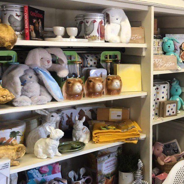 A shelf full of stuffed animals and a book called goodbye
