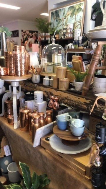 A store filled with lots of copper and ceramic items