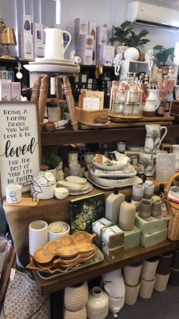 A store with a sign that says being loved