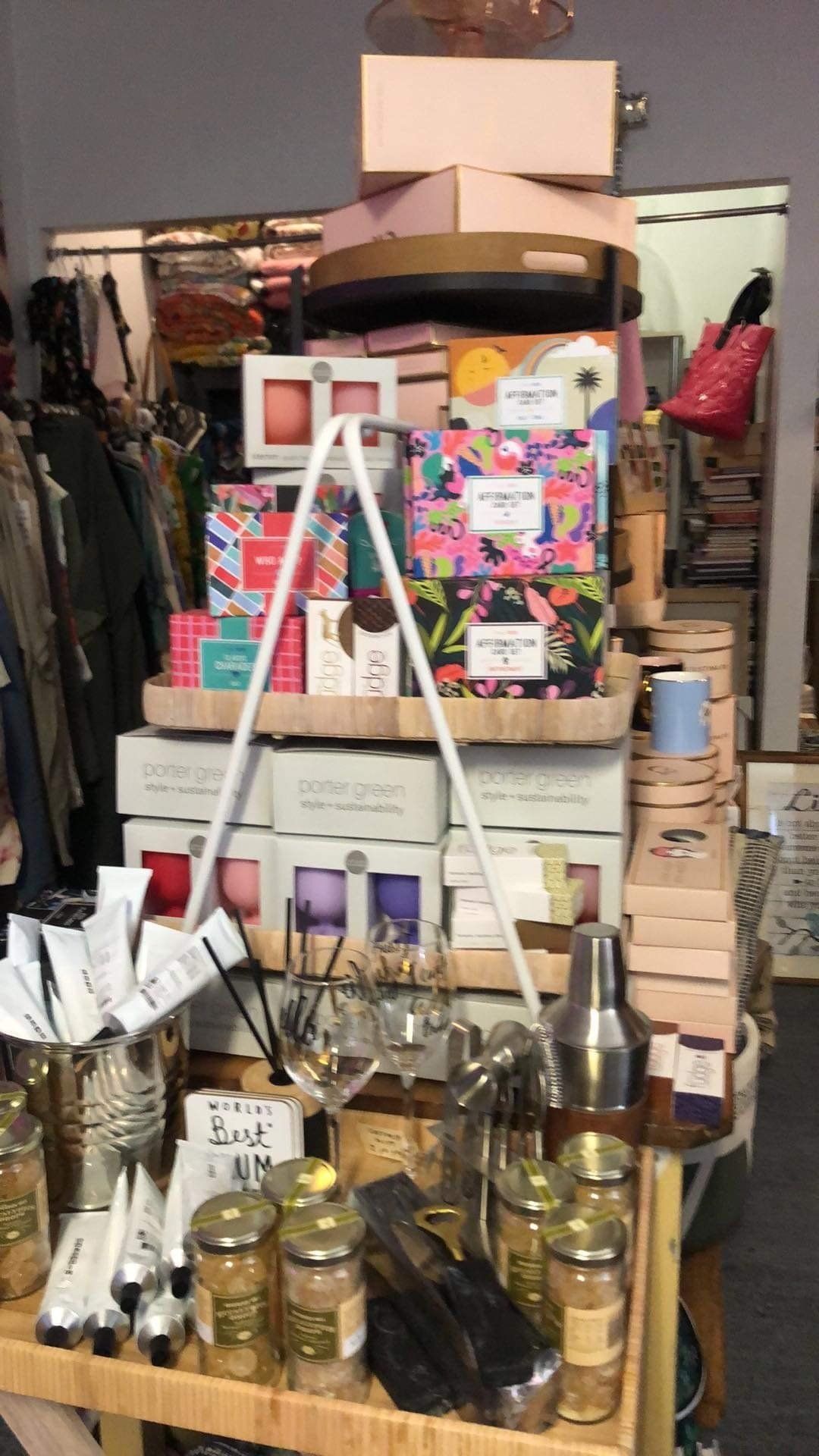A shelf filled with lots of boxes and candles in a store.