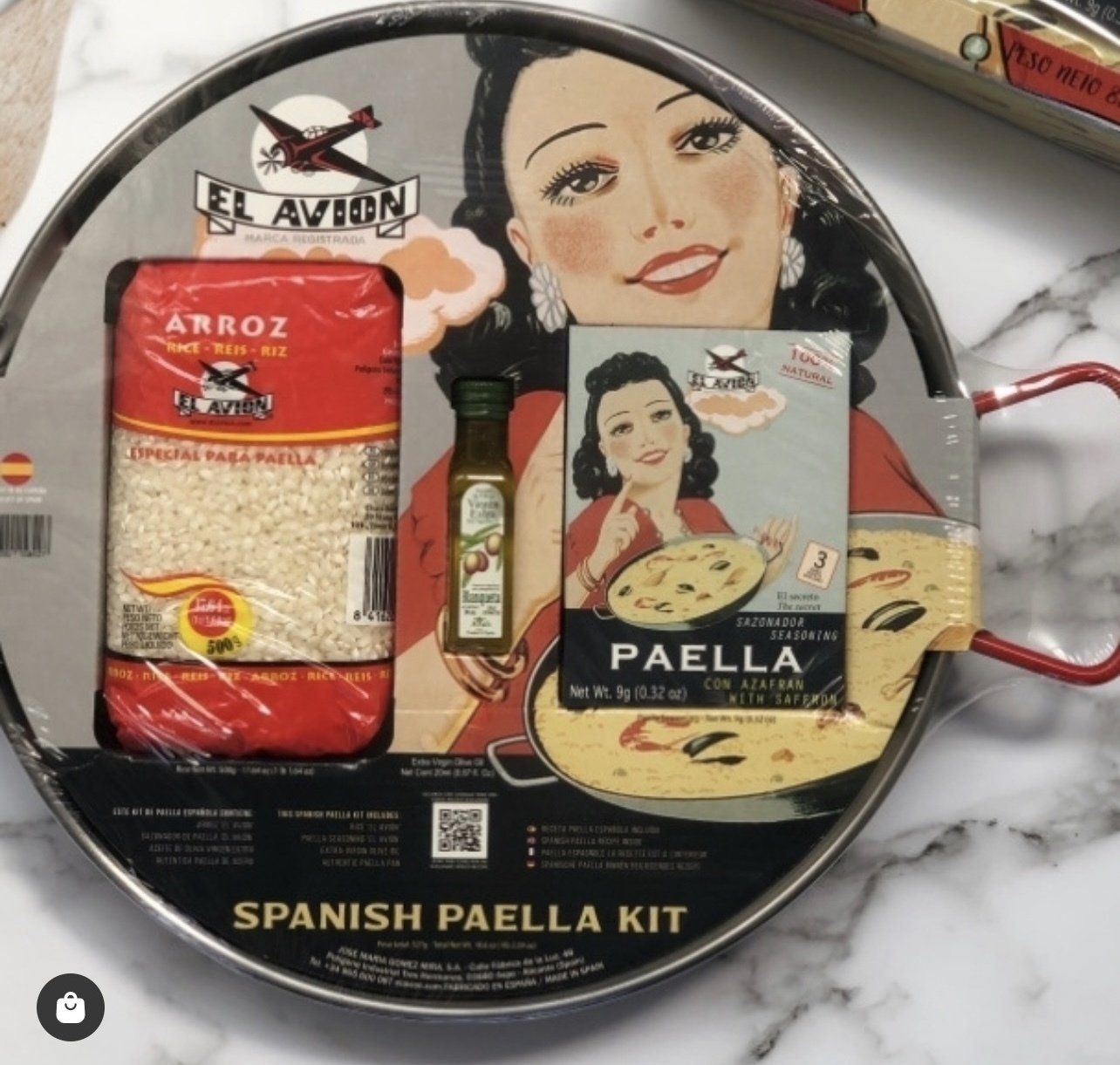 A spanish paella kit with a woman on it