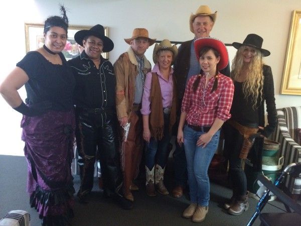A group of people dressed up as cowboys and cowgirls