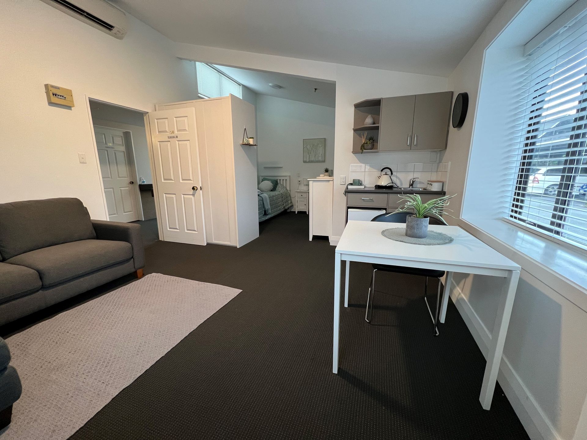 A living room with a couch and a table in it