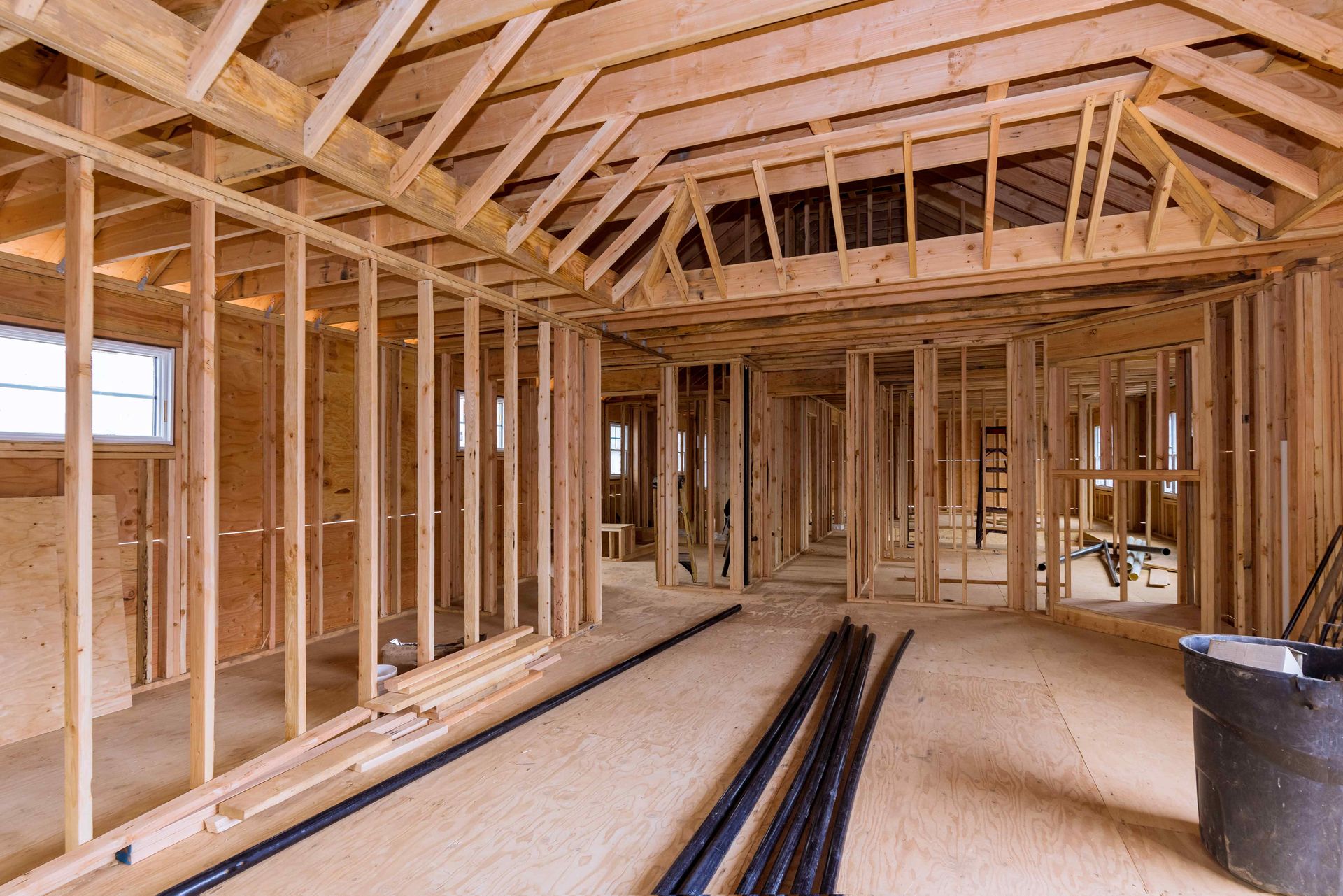 A house is being built with a lot of wooden beams.