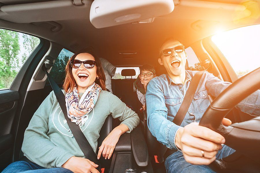 Bonds — Family Having a Happy Car Ride in Decatur, GA