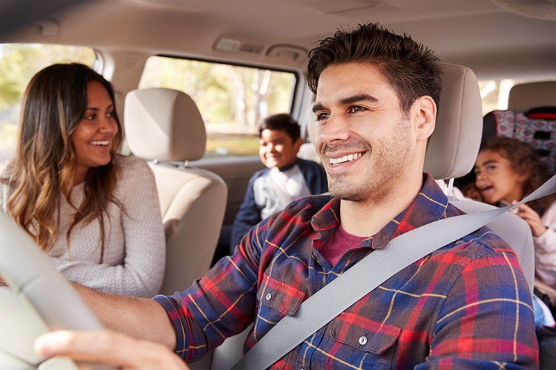 Car Insurance — Man Driving a Car with His Family in Decatur, GA