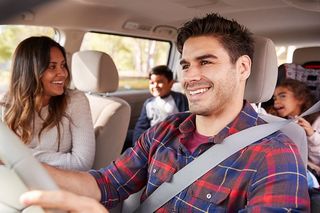 Car Insurance — Man Driving a Car with His Family in Decatur, GA