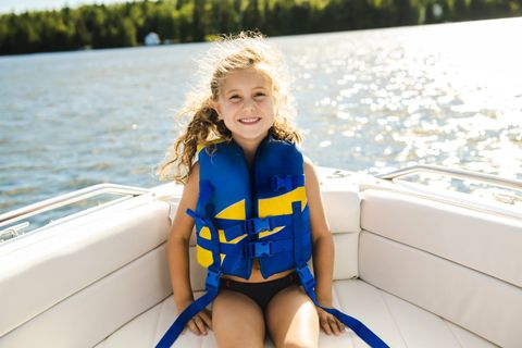 Boat Insurance — Family with Adorable Kids Resting on Yacht in Decatur, GA