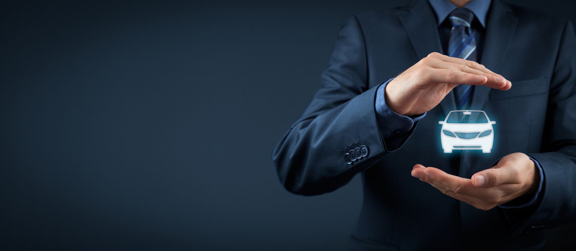 A businessman with a protective gesture and an icon of a car, showcasing commercial auto insurance.
