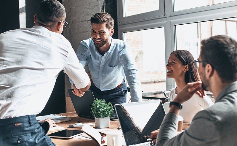 Cheap insurance — Young Men in Smart Casual Wear Shaking Hands in Decatur, GA