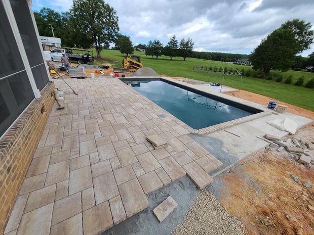 A paver concrete pool deck in Rock Hill, SC by Carolina Mega Concrete LLC