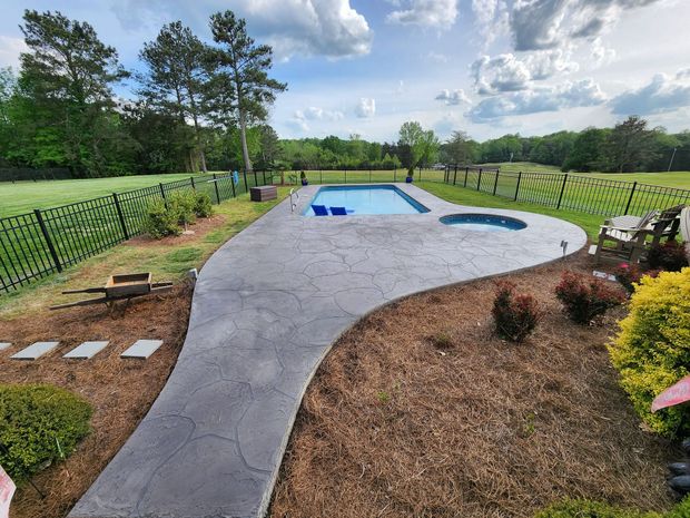 A stamped concrete pool deck in Rock Hill, SC by Carolina Mega Concrete LLC