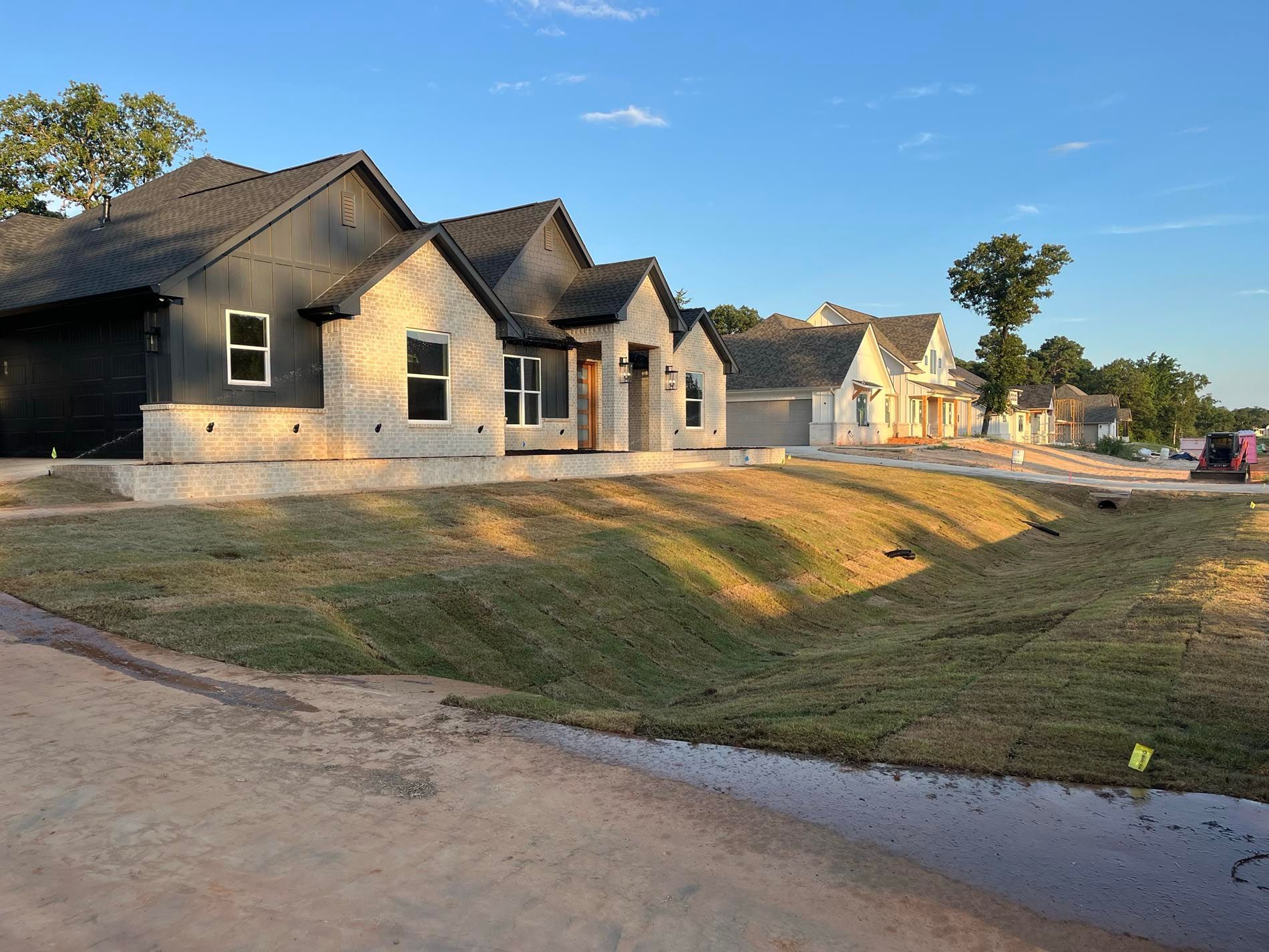 A row of houses are sitting next to each other on a hill.