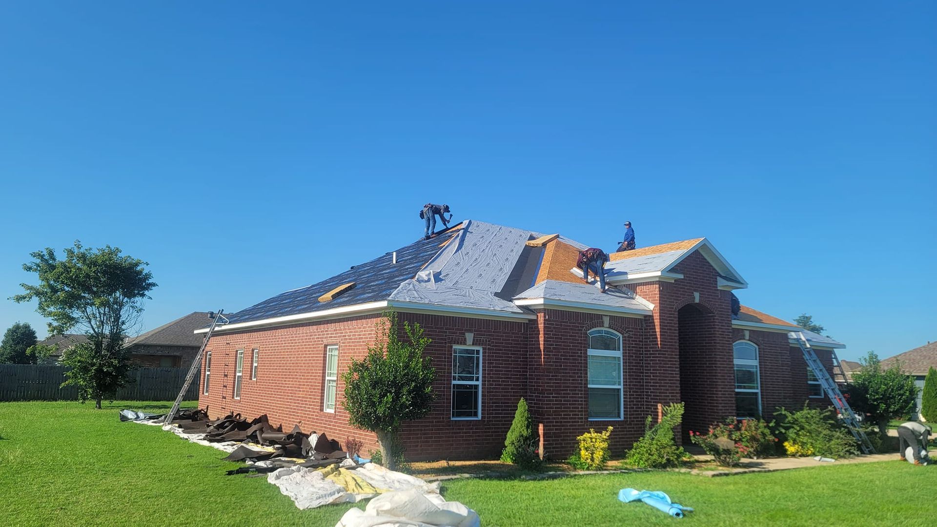 Brookland Roofing Team working on a storm damaged roof in Brookland, AR
