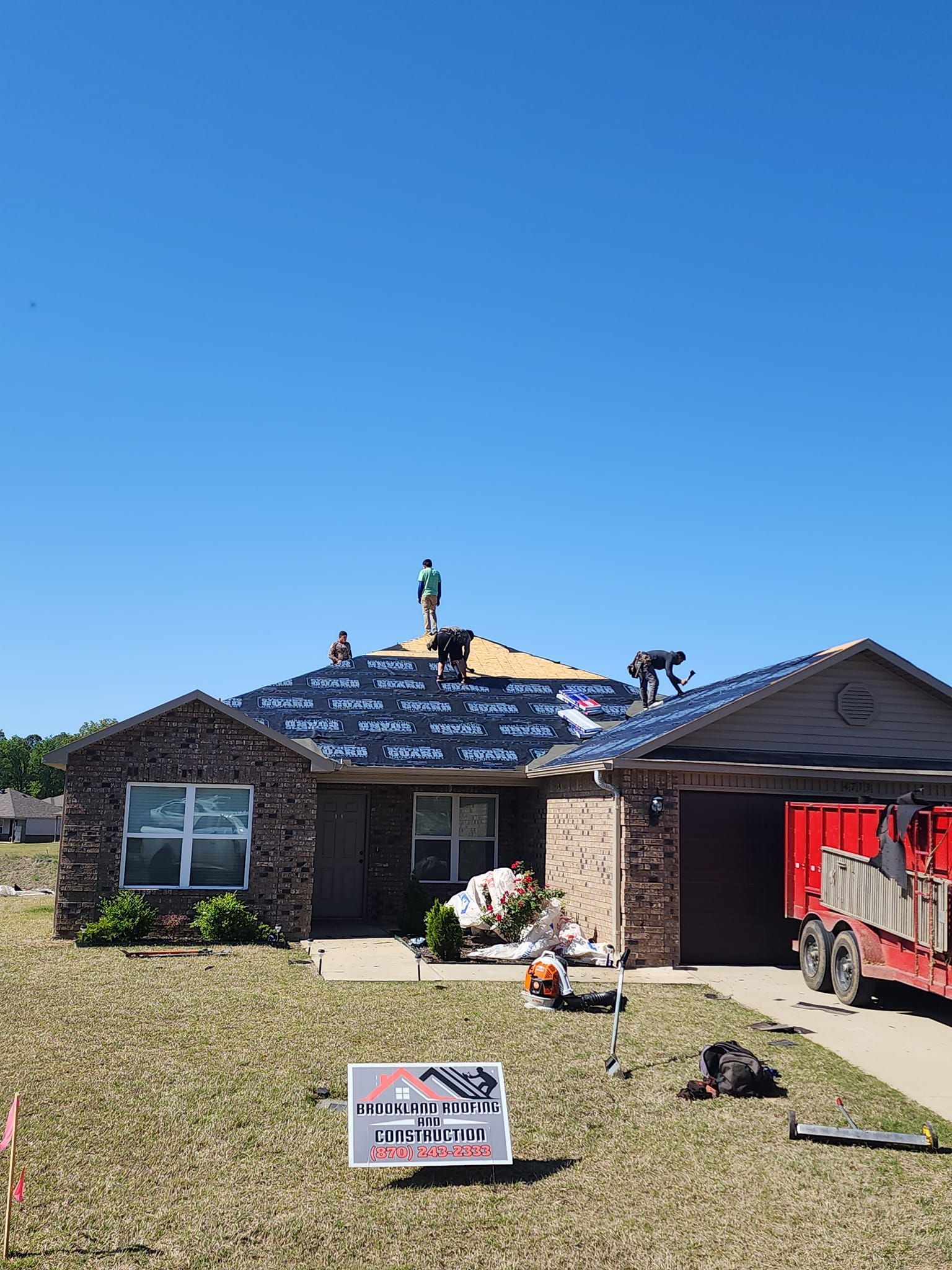 Brookland Roofing and Construction team working on a residential roof replacement in Brookland, AR.