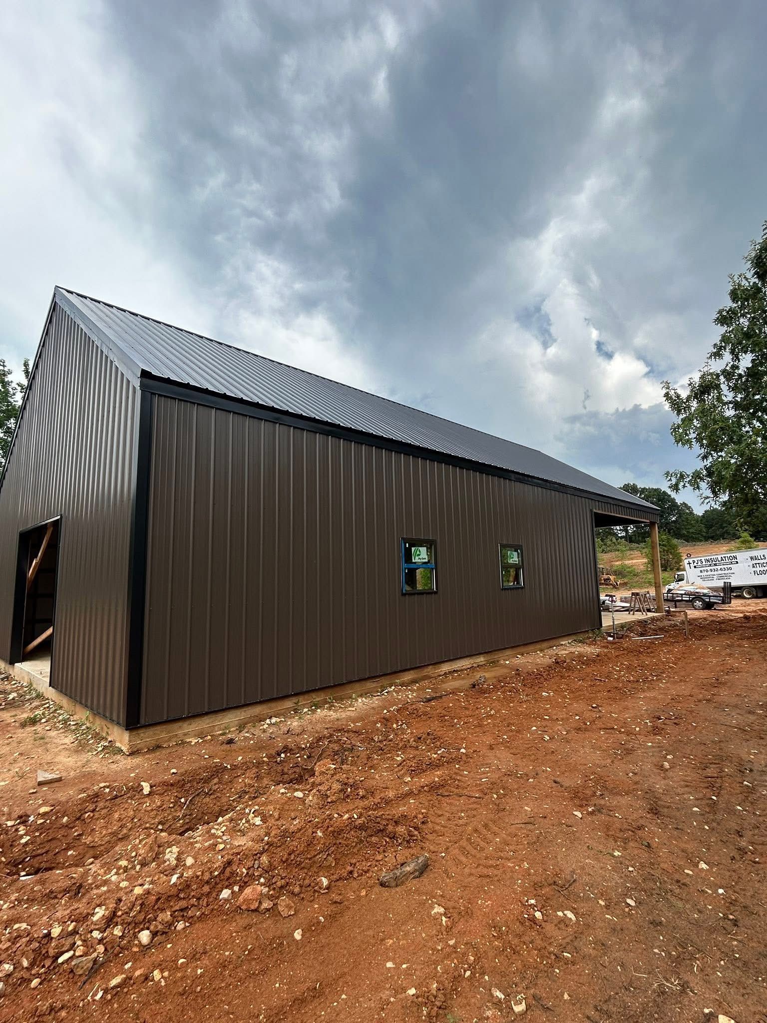 Image of a residential roof with an asphalt shingle installation by Brookland Roofing & Construction