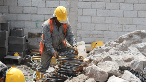 A Brookland Roofing team member working on a new building construction in Brookland, AR