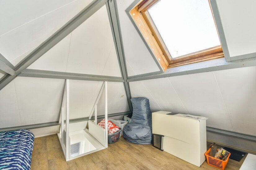 There is a skylight in the ceiling of the attic.