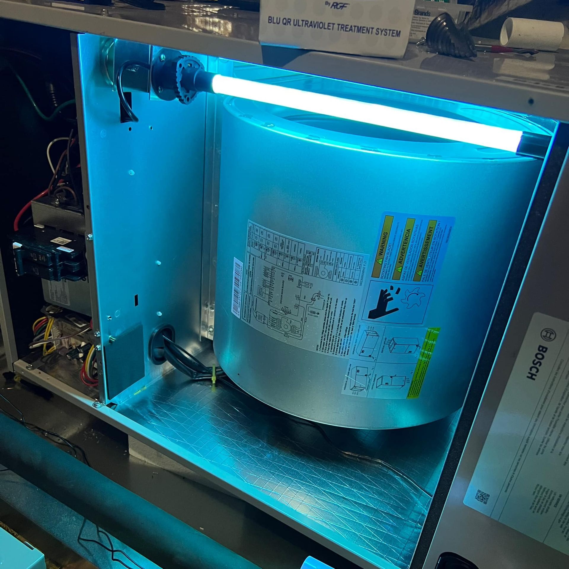 A bosch appliance with a blue light on it