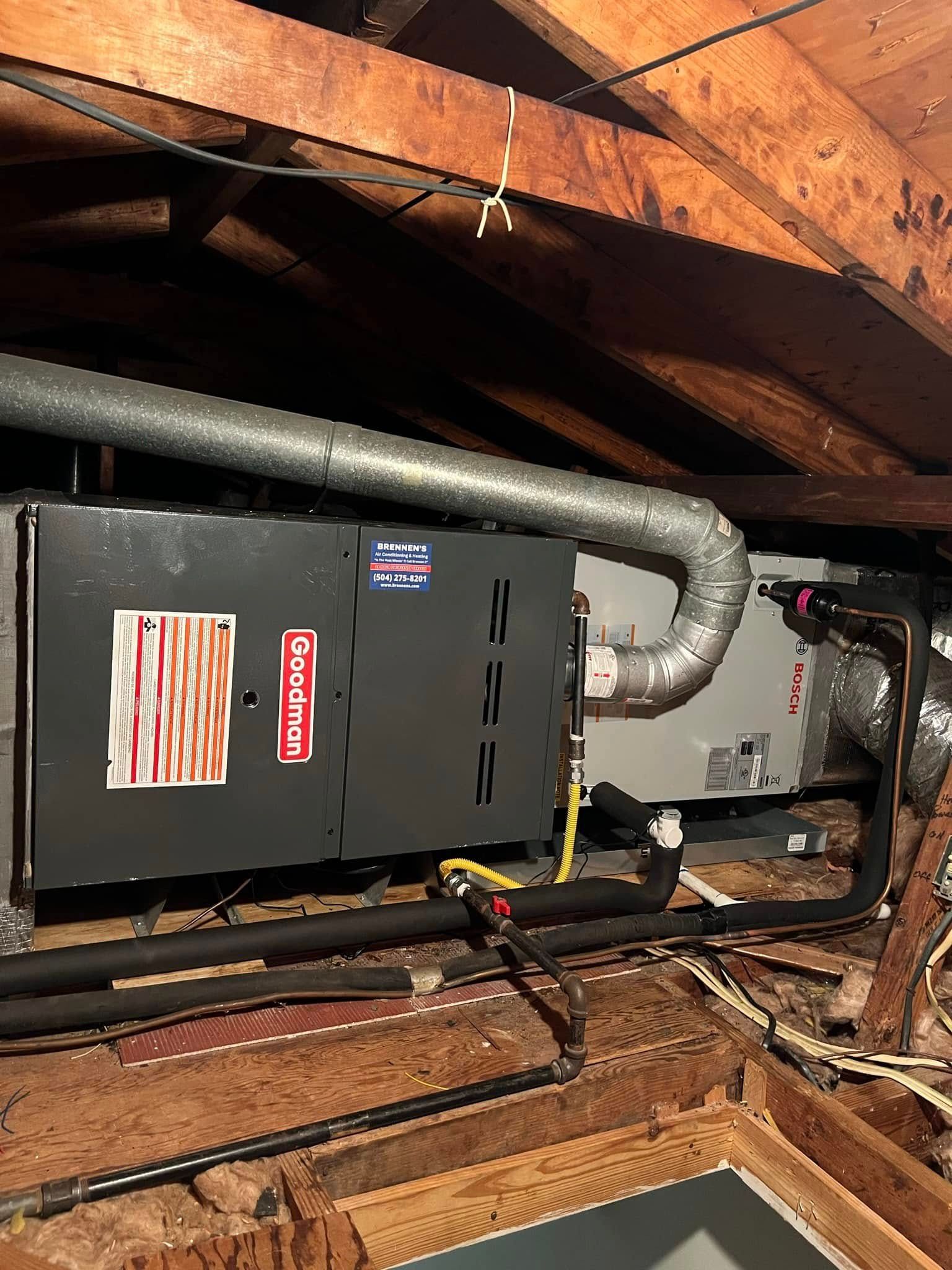 An air conditioner is installed in the attic of a house.
