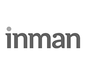 A black and white logo for inman on a white background.