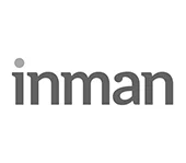A black and white logo for inman on a white background.
