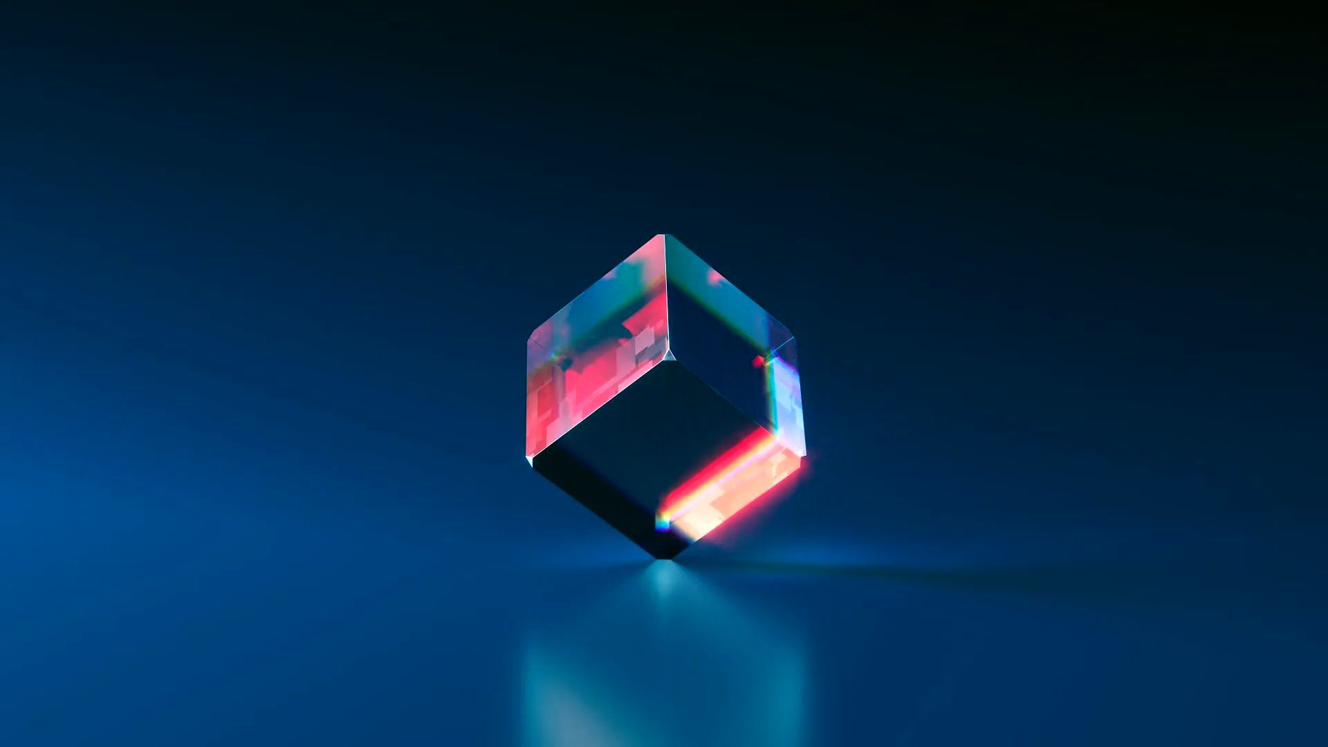 Geometric, glowing cube with colorful light on a dark blue background.