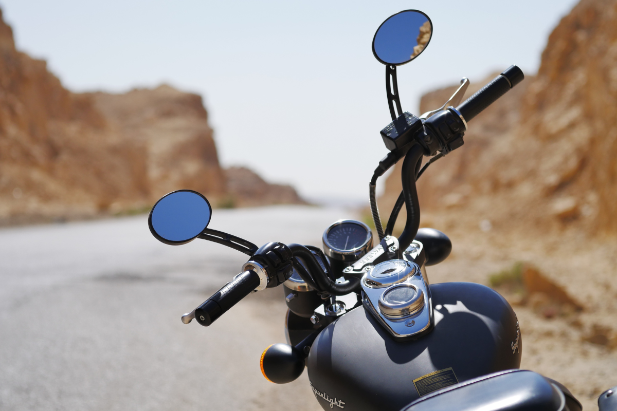 a motorcycle is parked on the side of the road