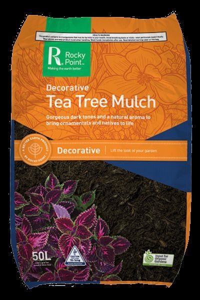 A Bag of Decorative Tea Tree Mulch with Purple Flowers on It — Edmonds Landscaping Supplies in Bohle Plains, QLD