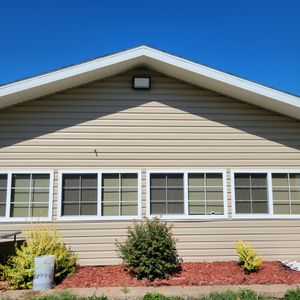 A house with a blue sky in the background