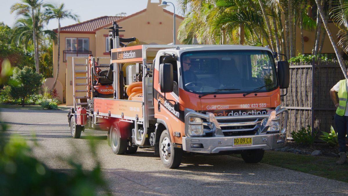 A Large Hole in the Ground With Pipes Coming Out of It — Gold Coast Leak Detection in Southport, QLD 
